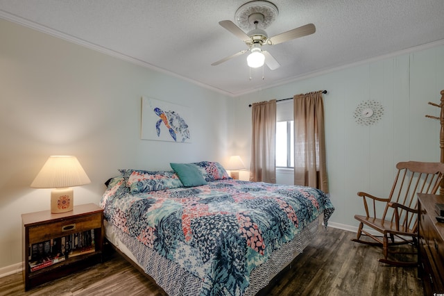 bedroom featuring ceiling fan, dark wood-type flooring, a textured ceiling, and ornamental molding