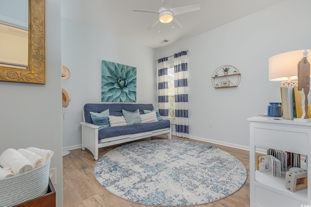 sitting room featuring ceiling fan and wood-type flooring