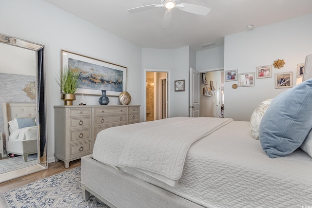 bedroom featuring light hardwood / wood-style floors and ceiling fan