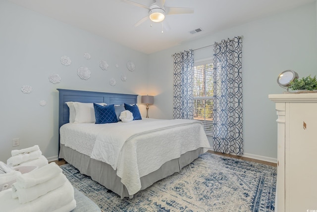 bedroom featuring hardwood / wood-style flooring and ceiling fan