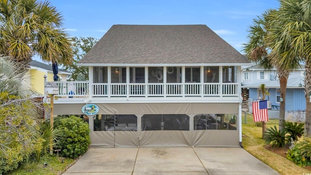 view of front of home featuring a sunroom