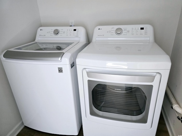 laundry room featuring washing machine and clothes dryer