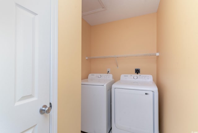 clothes washing area with washer and dryer