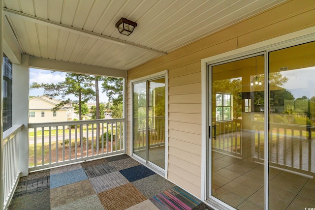 unfurnished sunroom featuring a healthy amount of sunlight