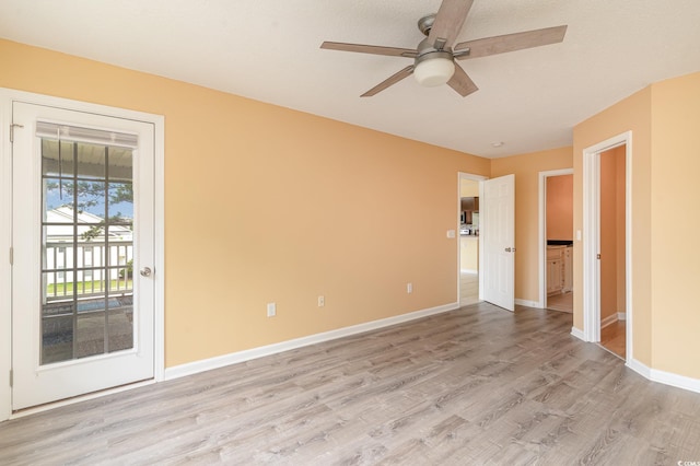 unfurnished room featuring ceiling fan and light wood-type flooring