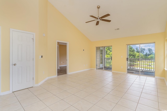 tiled spare room with high vaulted ceiling and ceiling fan