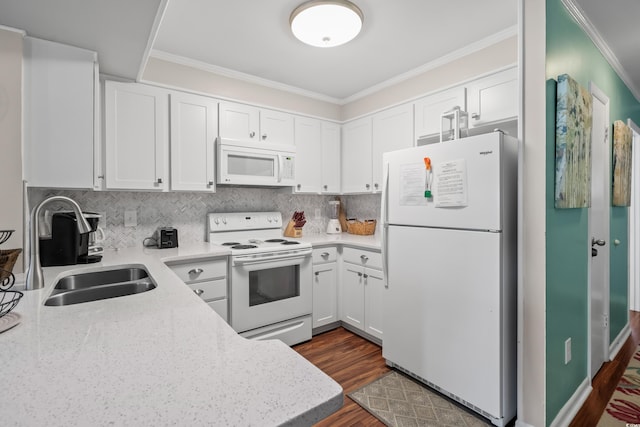 kitchen with white cabinetry, sink, and white appliances