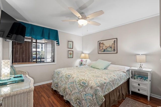 bedroom featuring ceiling fan, dark hardwood / wood-style flooring, and crown molding