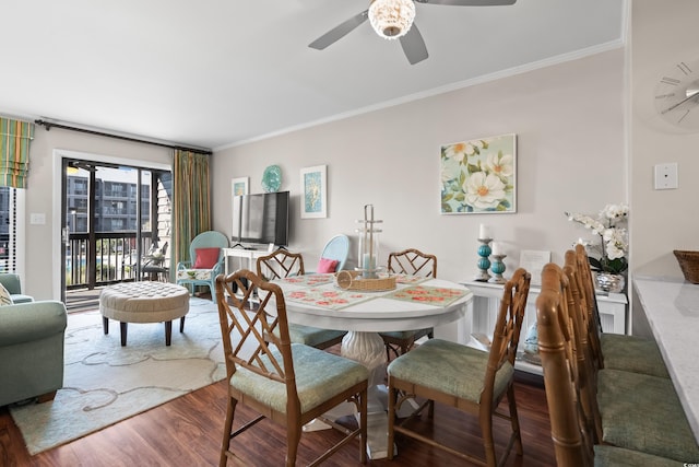 dining area with crown molding, hardwood / wood-style floors, and ceiling fan