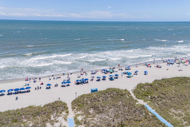 bird's eye view featuring a beach view and a water view