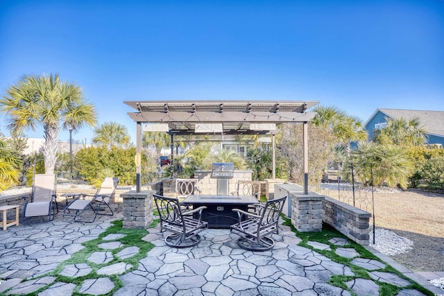 view of patio featuring a pergola and exterior kitchen