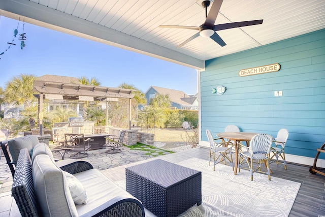 view of patio featuring an outdoor living space with a fireplace and ceiling fan