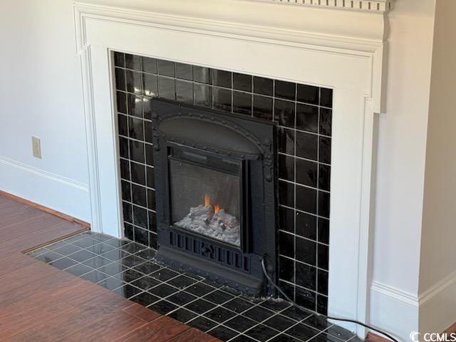 details with a tile fireplace