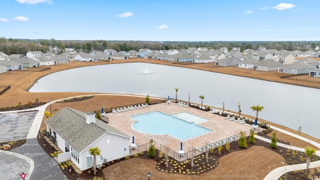 view of swimming pool with a water view