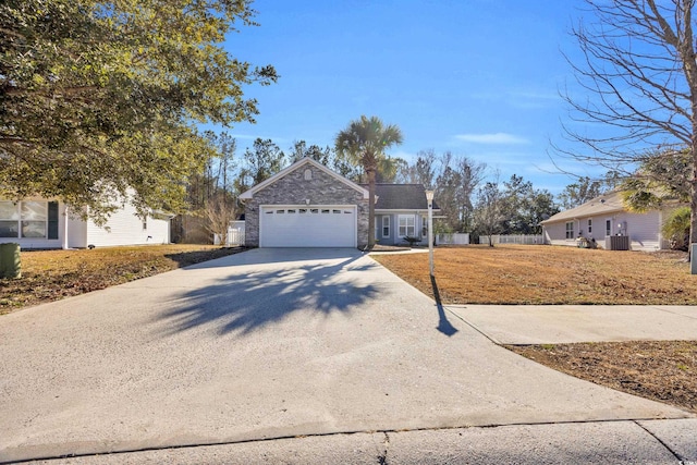 view of front of home featuring a garage and cooling unit