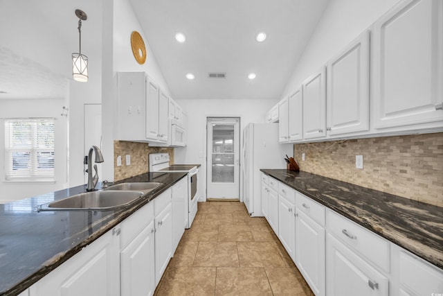 kitchen with sink, pendant lighting, lofted ceiling, white appliances, and white cabinets