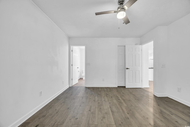 unfurnished bedroom with ceiling fan and wood-type flooring