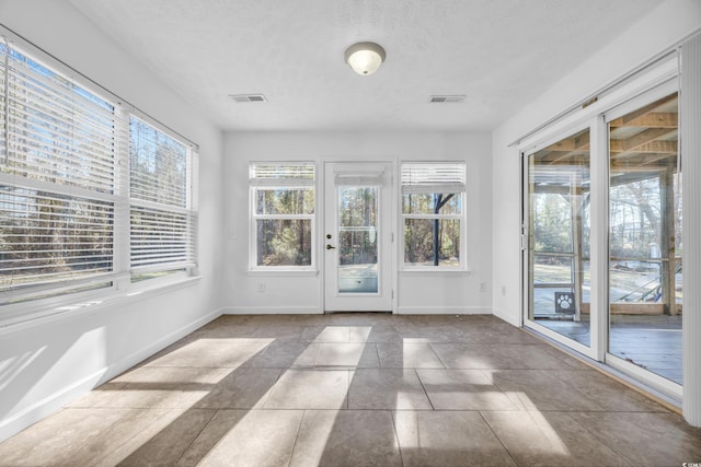 view of unfurnished sunroom