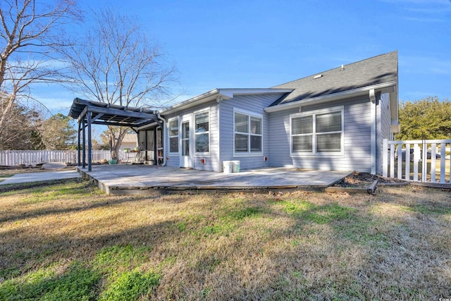 view of home's exterior featuring a lawn and a wooden deck