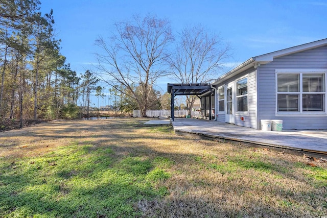 view of yard with a pergola and a patio