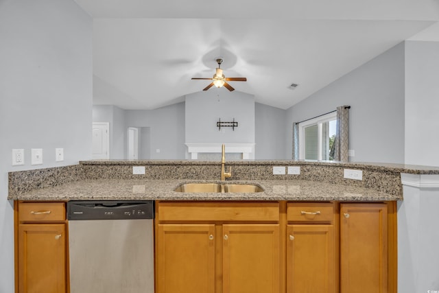 kitchen featuring sink, vaulted ceiling, stainless steel dishwasher, ceiling fan, and light stone countertops