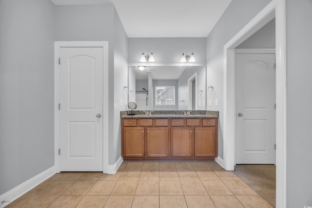 bathroom featuring tile patterned floors and vanity