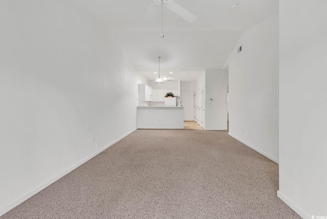 unfurnished living room with ceiling fan