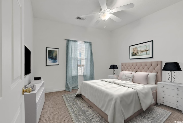 bedroom with ceiling fan and light colored carpet