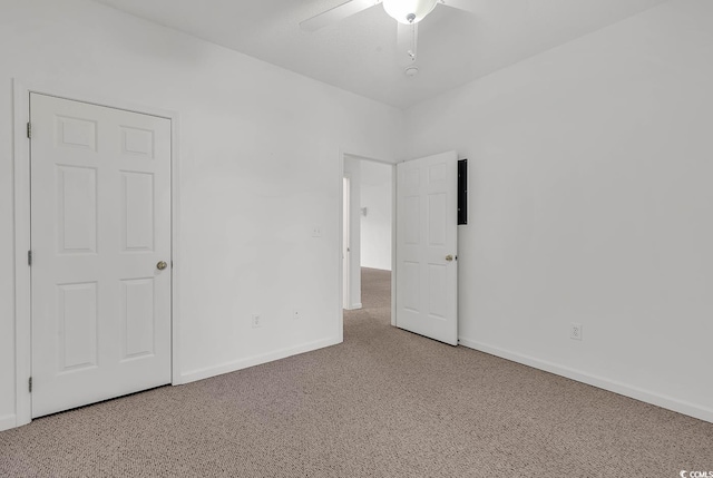 unfurnished bedroom with carpet and ceiling fan