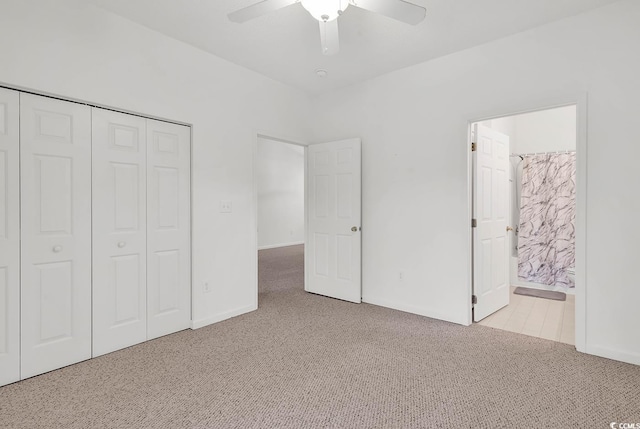 unfurnished bedroom with ceiling fan, connected bathroom, light carpet, and a closet