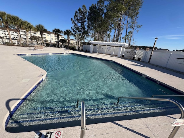 view of swimming pool featuring a patio