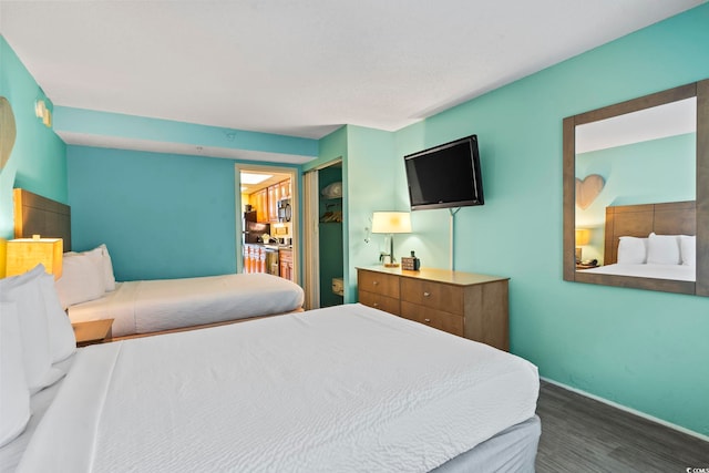 bedroom featuring dark hardwood / wood-style flooring