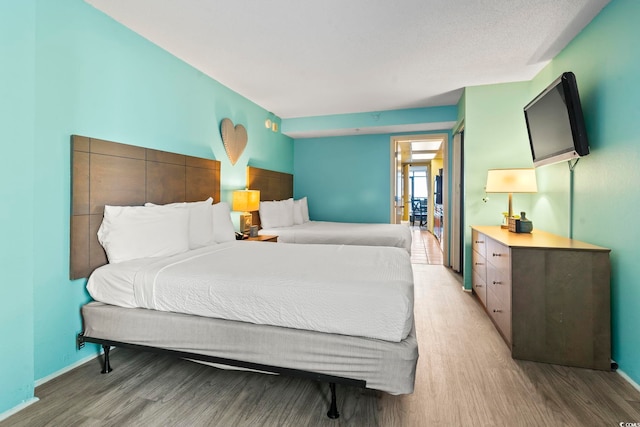 bedroom featuring light wood-type flooring