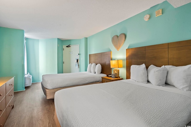 bedroom featuring wood-type flooring