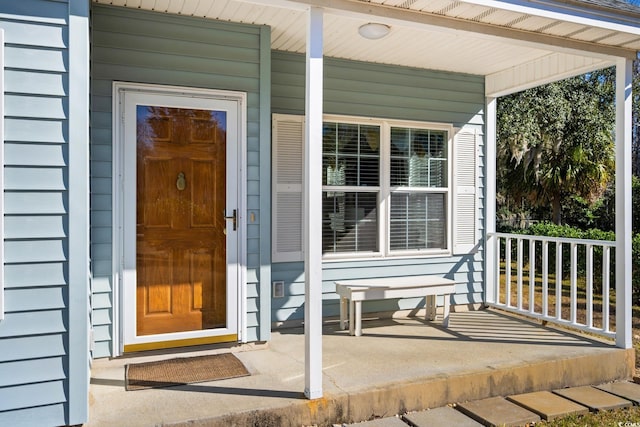 doorway to property featuring a porch