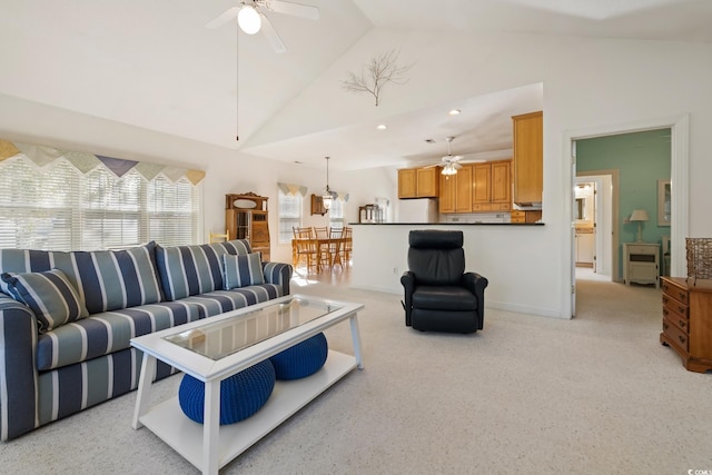 living room with high vaulted ceiling and ceiling fan