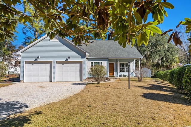 view of front of house with a garage and a front yard