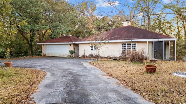 ranch-style house featuring a garage