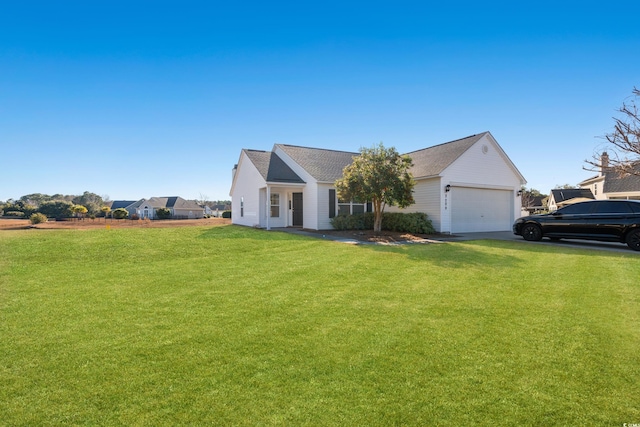 view of front of house featuring a garage and a front lawn