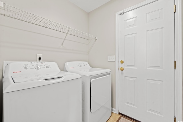 laundry room featuring washing machine and dryer