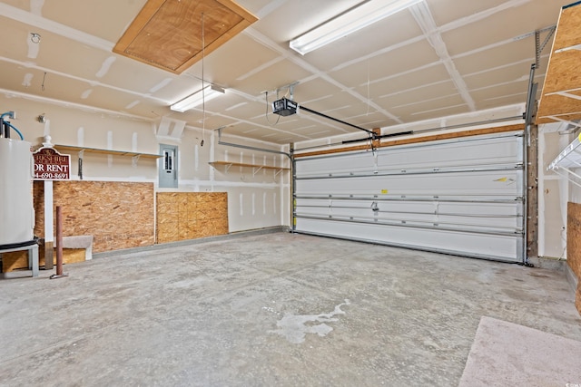 garage featuring electric panel and a garage door opener