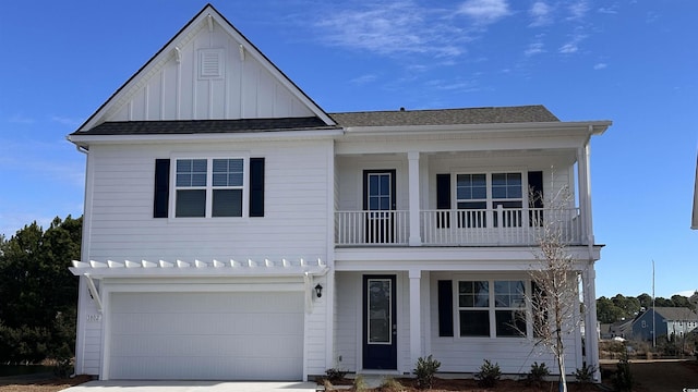 view of front of house featuring a balcony and a garage