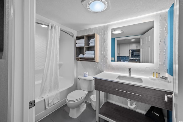 2006 N Ocean Blvd Unit 776, Myrtle Beach, SC 29577 - bathroom featuring tile patterned floors, toilet, shower / bath combination with curtain, a textured ceiling, and vanity