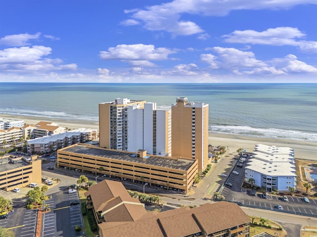 bird's eye view with a water view and a view of the beach