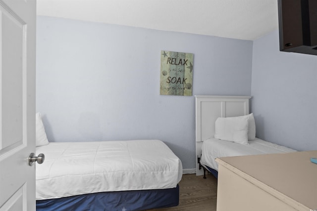 bedroom with wood-type flooring