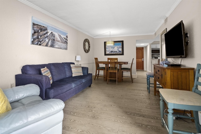 living room featuring hardwood / wood-style floors and ornamental molding