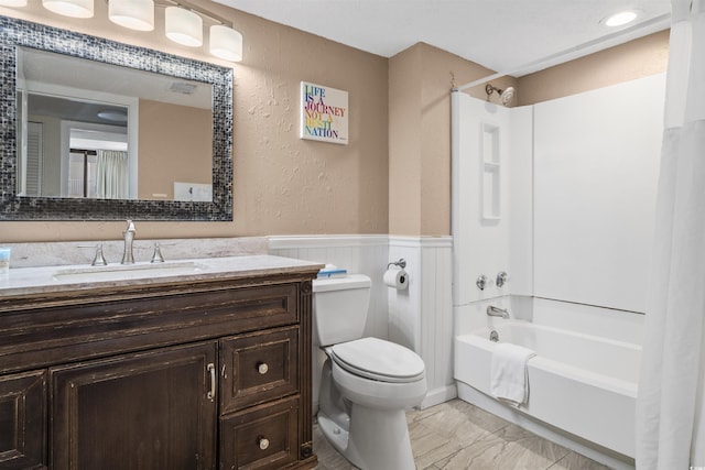 full bathroom with bathtub / shower combination, vanity, and toilet