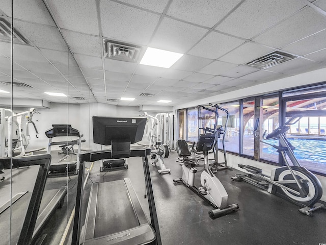 exercise room featuring a paneled ceiling