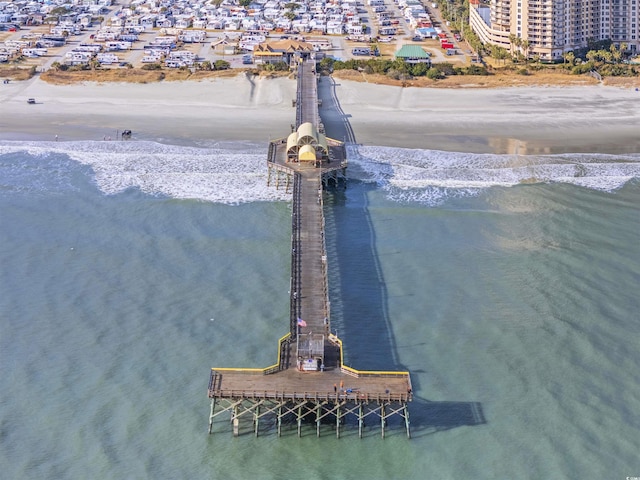 exterior space featuring a beach view and a water view