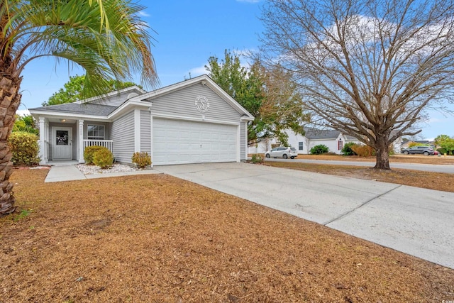 single story home featuring covered porch and a garage